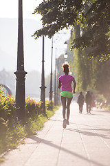 Image showing african american woman jogging in the city