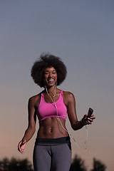 Image showing black woman is doing stretching exercise relaxing and warm up