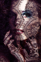 Image showing portrait of beauty young woman through lace close up mistery mak