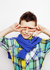 Image showing young pretty little boy kid wondering, posing emotional face isolated on white background, gesture happy smiling close up, lifestyle people concept