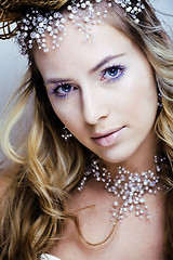 Image showing beauty young snow queen with hair crown on her head, complicate 