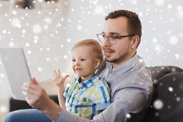 Image showing father and son with tablet pc playing at home