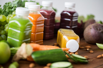 Image showing bottles with different fruit or vegetable juices