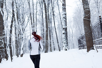 Image showing Photo of young woman running