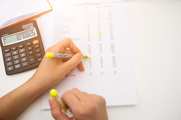 Image showing Accountant working with paperwork, reports