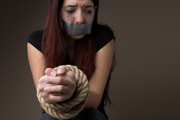 Image showing Unhappy woman with sealed mouth