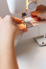 Image showing Seamstress work on sewing machine