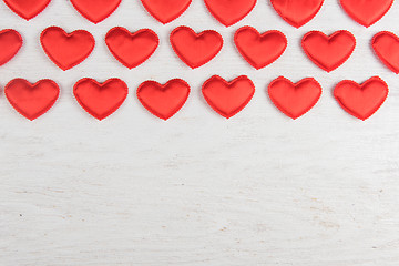 Image showing Red hearts on a white wood background