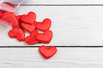 Image showing Red hearts on a white wood background