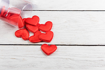 Image showing Red hearts on a white wood background