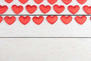 Image showing Red hearts on a white wood background