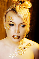 Image showing beauty blond woman with gold creative make up