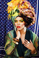 Image showing beauty bright woman with creative make up, many shawls on head l