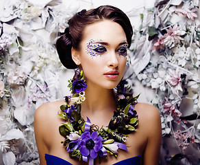 Image showing floral face art with anemone in jewelry, sensual young brunette 