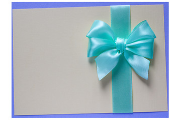 Image showing Turquoise bow and ribbon on card