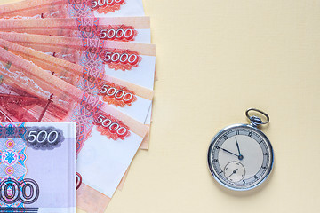 Image showing Ruble banknotes and vintage watches