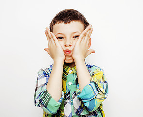 Image showing young pretty little boy kid wondering, posing emotional face isolated on white background, gesture happy smiling close up, lifestyle people concept