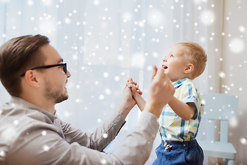 Image showing father with son playing and having fun at home