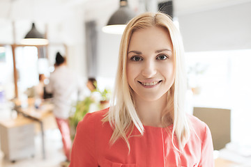 Image showing happy creative woman at office or bureau