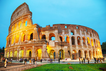 Image showing The Colosseum with people at night 