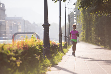 Image showing african american woman jogging in the city