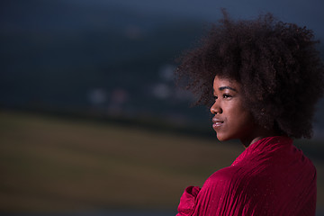 Image showing outdoor portrait of a black woman with a scarf