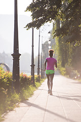 Image showing african american woman jogging in the city