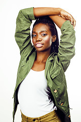 Image showing young pretty african-american girl posing cheerful emotional on white background isolated, lifestyle people concept