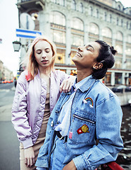 Image showing cute young couple of teenagers girlfriends having fun, traveling europe, modern fashion citylife, lifestyle people concept