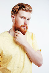 Image showing young handsome hipster ginger bearded guy looking brutal isolated on white background, lifestyle people concept