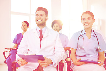 Image showing group of happy doctors on seminar at hospital