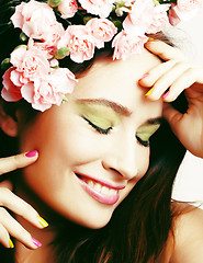 Image showing Beauty young real woman with flowers and make up closeup, lifestyle people