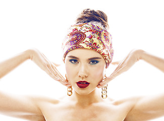 Image showing young pretty modern girl with bright shawl on head emotional posing isolated on white background, asian people ethnicity