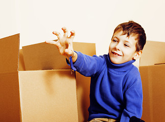 Image showing little cute boy in empty room, remoove to new house. home alone, lifestyle people concept