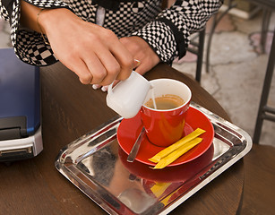 Image showing Preparing coffee latte