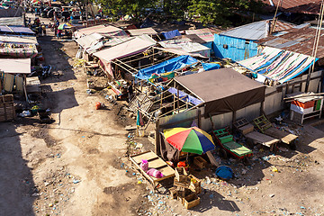 Image showing poor houses by the river in shantytown