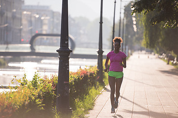 Image showing african american woman jogging in the city