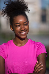 Image showing Portrait of sporty young african american woman running outdoors