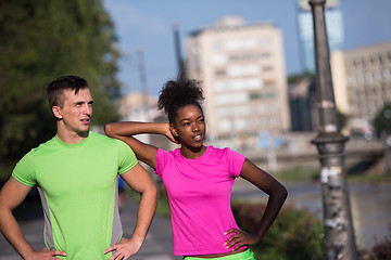 Image showing portrait of young multietnic jogging couple ready to run