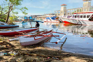 Image showing poor houses by the river in shantytown