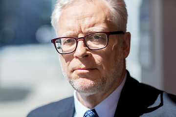 Image showing close up of senior businessman in eyeglasses