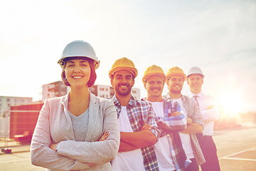 Image showing happy builders and architect at construction site