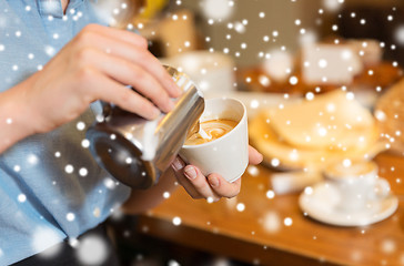 Image showing close up of woman making coffee at shop or cafe