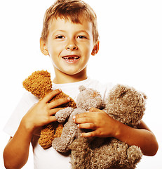 Image showing little cute boy with many teddy bears hugging isolated close up