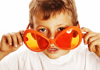 Image showing little cute boy in orange sunglasses pointing isolated close up 