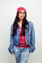 Image showing young happy smiling latin american teenage girl emotional posing on white background, lifestyle people concept, school uniform wearing glasses