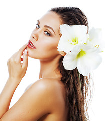 Image showing young pretty woman with  Amarilis flower close up isolated on wh