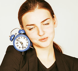 Image showing young beauty woman in business style costume waking up for work 