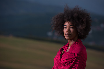 Image showing outdoor portrait of a black woman with a scarf