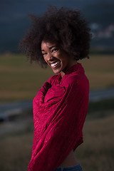 Image showing outdoor portrait of a black woman with a scarf